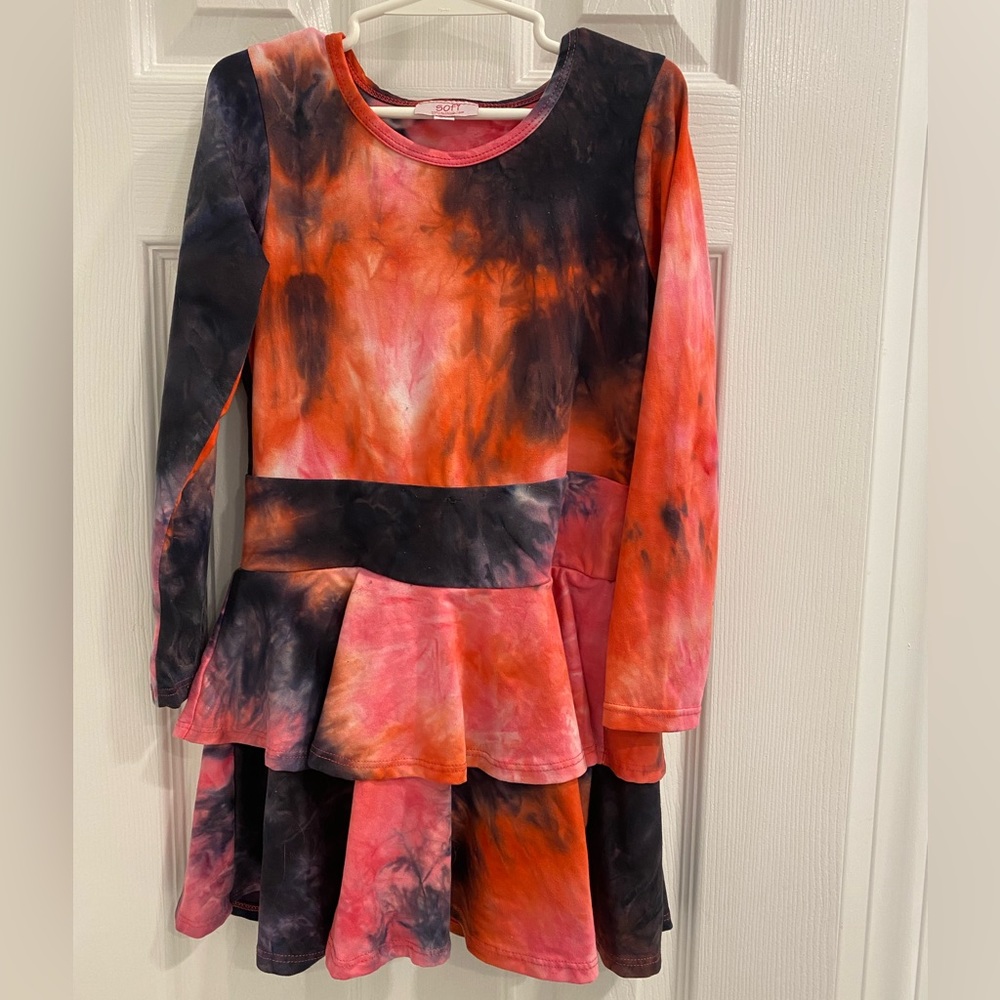 Sofi girls trendy dress with ruffles on the skirt and sleeve.